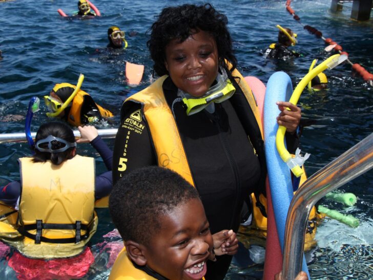 Snorkel Without Knowing How To Swim | Photo of adult and child snorkelers exiting Great Barrier Reef