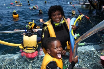 Photo from family cruise ofParent and child returning from snorkeling