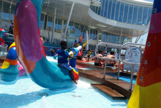 photo of small child playing in cruise ship splash park