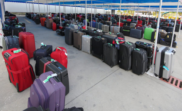 Disembarkation Day | photo of large groups of luggage under awning