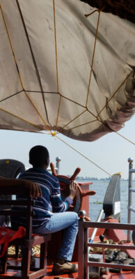 Independent Excursions - Cochin -photo of child driving houseboat