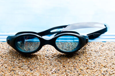 Water safety for kids - photo of child goggles on pool deck