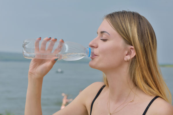 Cruise Drinks Package - photo of woman drinking from bottled water