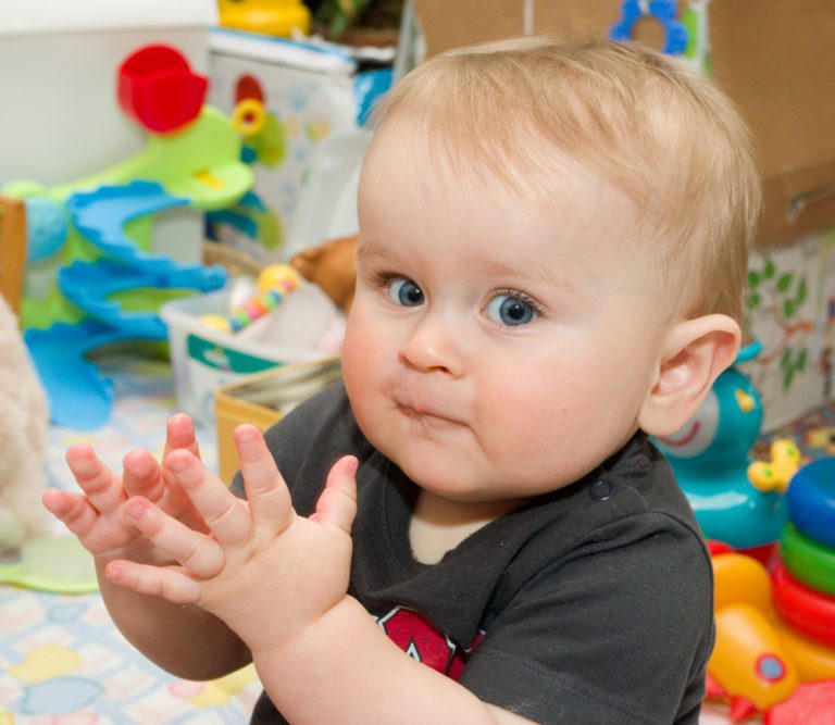 cruise childcare | happy baby clapping