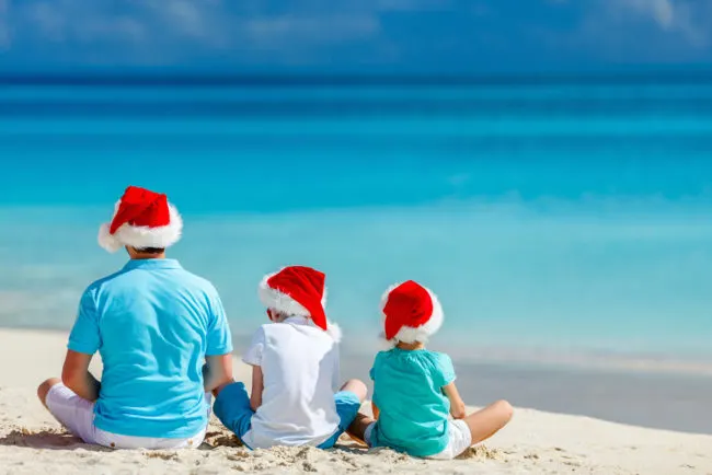 Holiday Cruise | photo of family on beach in santa hats