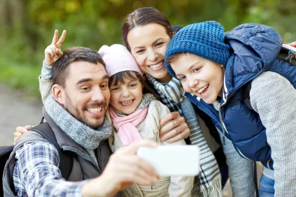 what to pack for Alaska cruise |family taking selfie with smartphone 