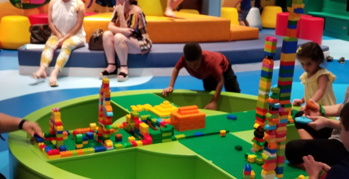 MSC Seaside Review | Family Lego Night on MSC Seaside cruise - adults and children playing with Legos.