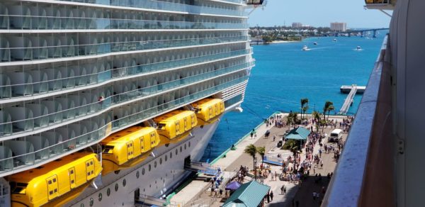 First Time Cruisers | aerial view of passengers on dock near cruise ships