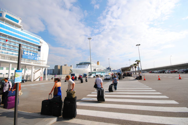 Carry On Cruise Bag | photo of passengers taking large luggage onto cruise ship