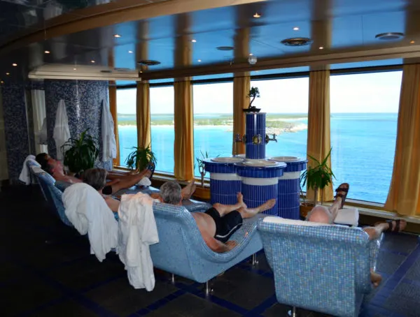 Cruise Spa | group of men enjoying a favored cruise activity, sitting on heated loungers in spa
