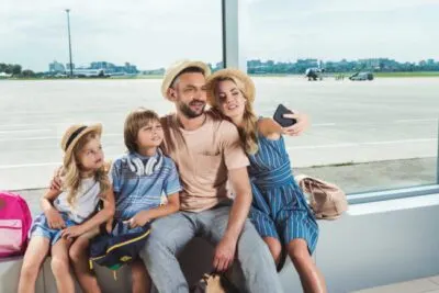 Family Travel Hacks | photo of family in airport taking selfie