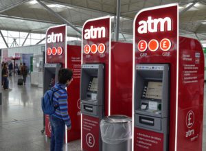 Travel Hacks | photo of child at airport ATM