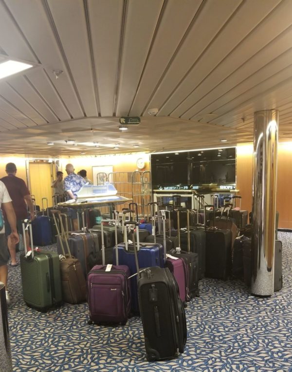 Cruise passenger luggage waiting to be distributed.