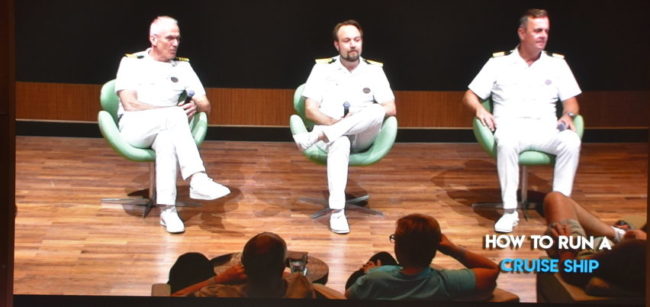 How Much Does A Cruise Captain Make | photo of three ship's officers presenting program on running a cruise ship