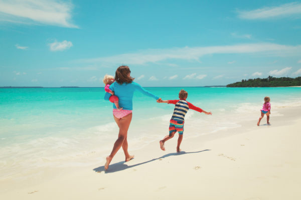 Single Parents Cruise | photo of mom running after kids on the beach