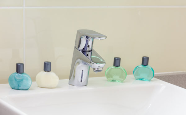 Do cruise ships provide shampoo | photo of sink with miniature toiletries