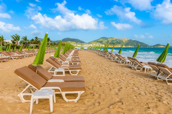 St Maarten Beaches Near Cruise Port | photo of Orient Bay Beach - line of waiting lounge chairs