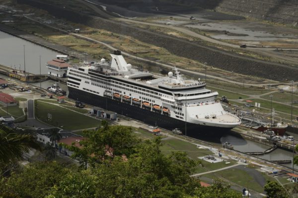Best Time To Cruise The Panama Canal | photo of a cruise ship sailing through Pedro Miguel Locks, Panama Canal