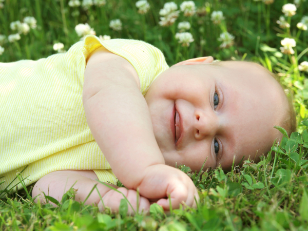 How To Keep Mosquitoes Away From Babies | photo of happy baby on grass