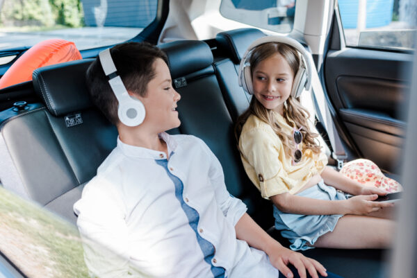 How Do Wireless Headphones Work | photo of kids with headphones in car