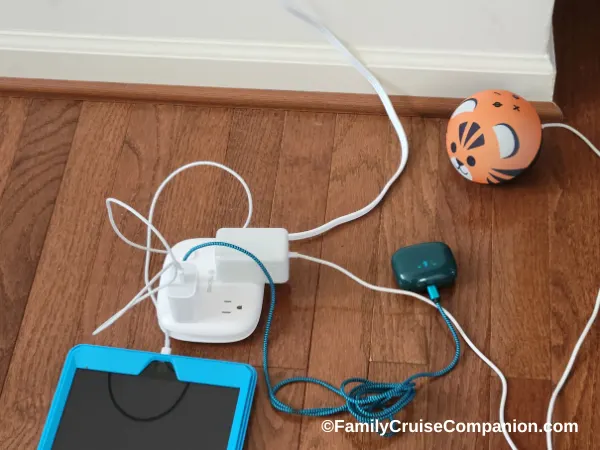 photo of Trond compact power strip with iPad, wireless earbuds and Alexa device