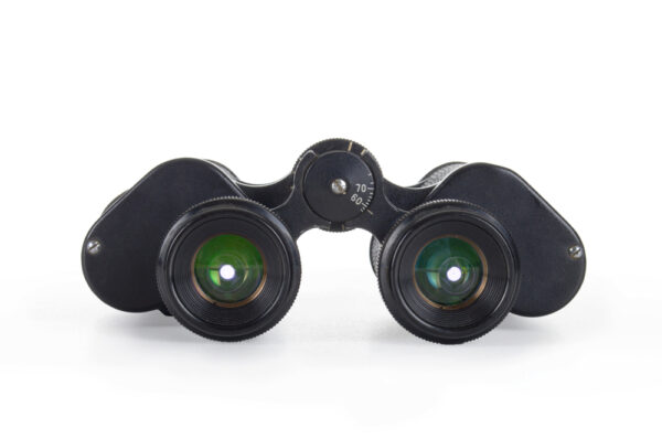 What do the numbers on binoculars mean | isolated close-up photo of black binoculars