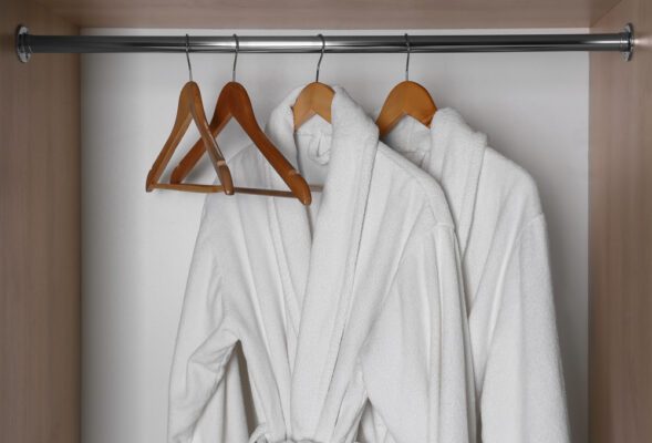 Royal Caribbean Junior Suite Perks | photo of plush bathrobes hanging in closet