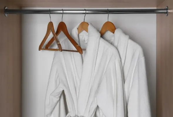 Royal Caribbean Junior Suite Perks | photo of plush bathrobes hanging in closet