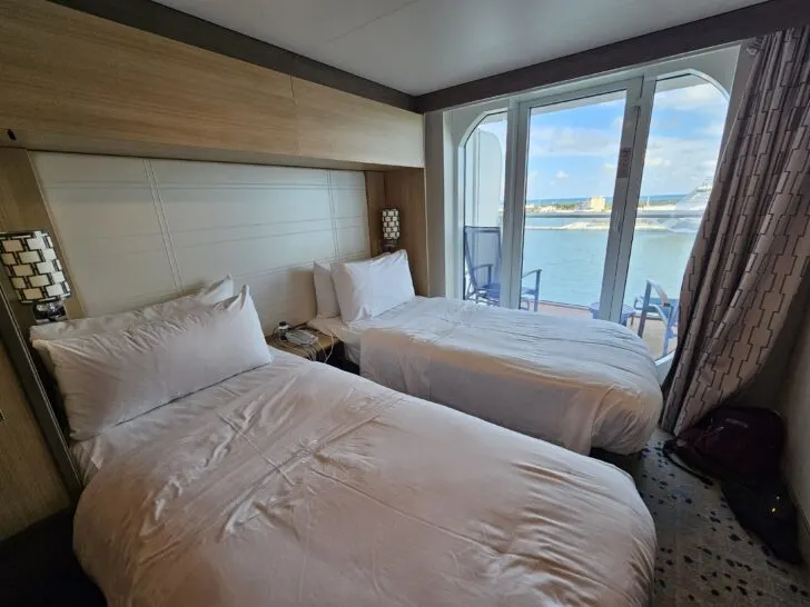 Photo of ocean view balcony room on Celebrity cruise ship with two bed configuration.