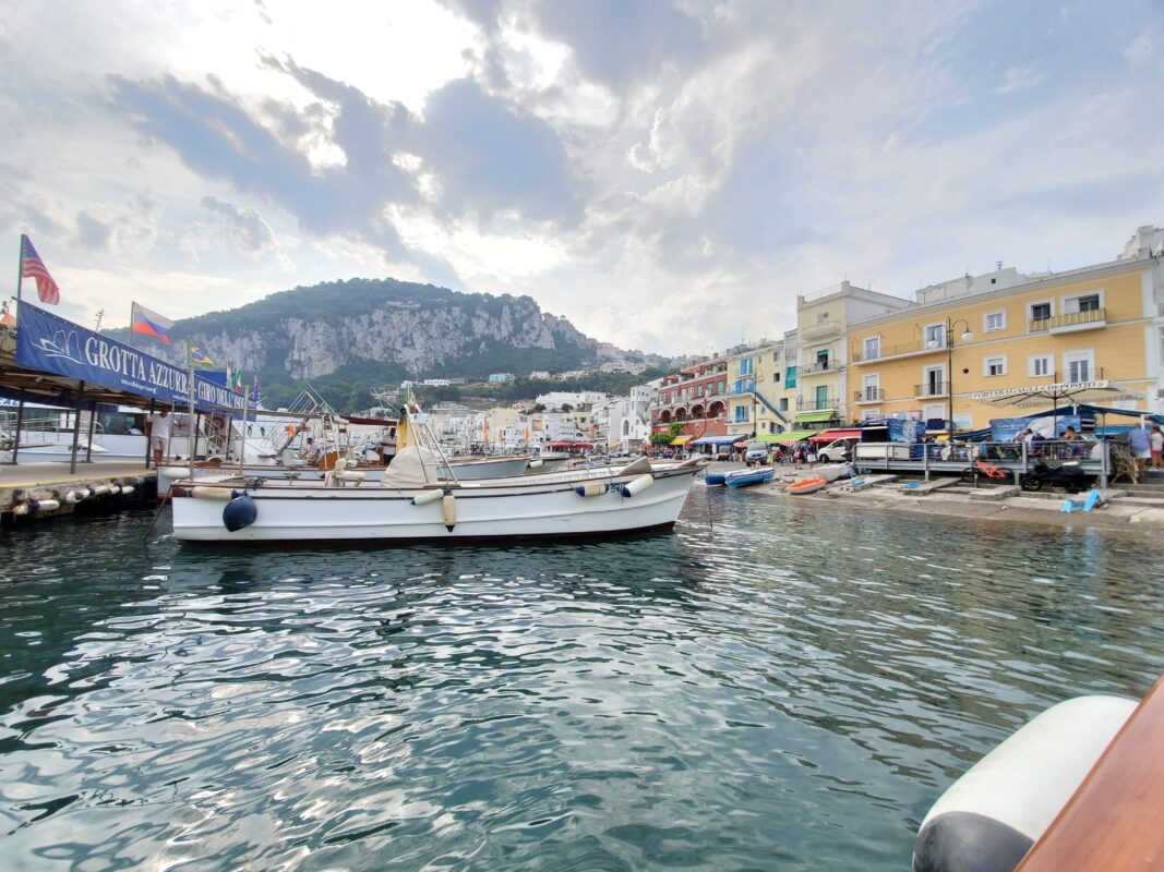 Tour boats in Capri waiting to ferry passengers to the Blue Grotto.