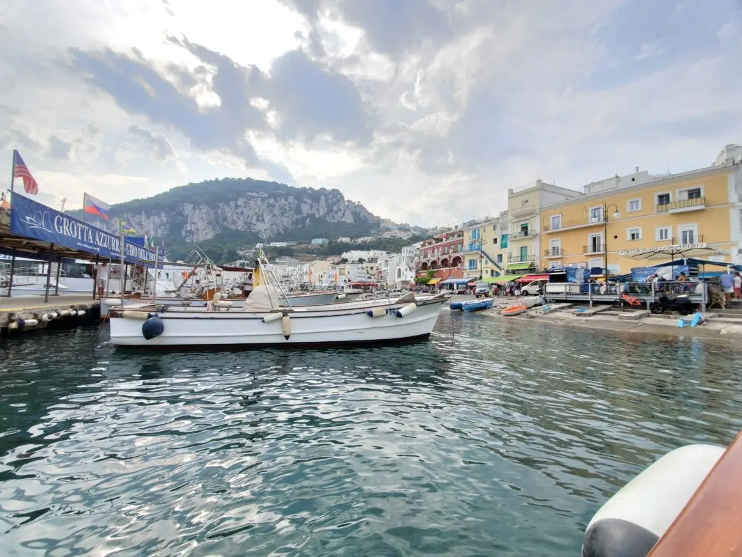 Tour boats in Capri waiting to ferry passengers to the Blue Grotto.