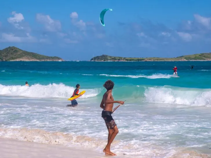 Cruise the Caribbean | photo of young windsurfers on the beach