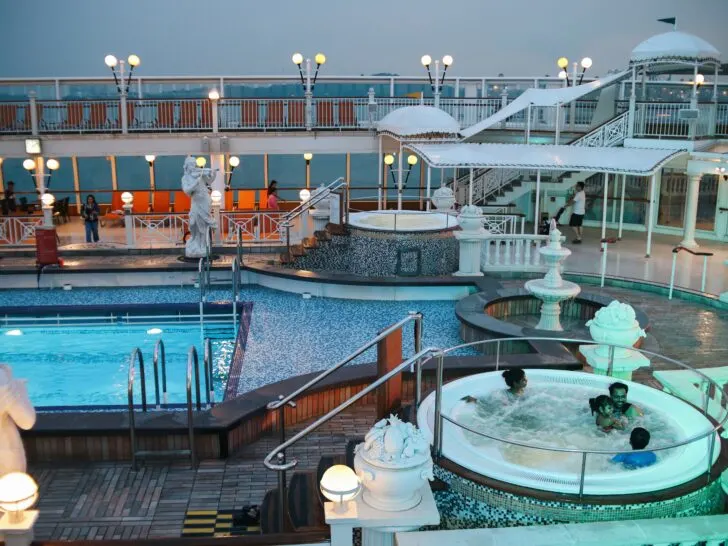 Cruise the Caribbean | Photo of happy family enjoying cruise ship hot tub at dusk