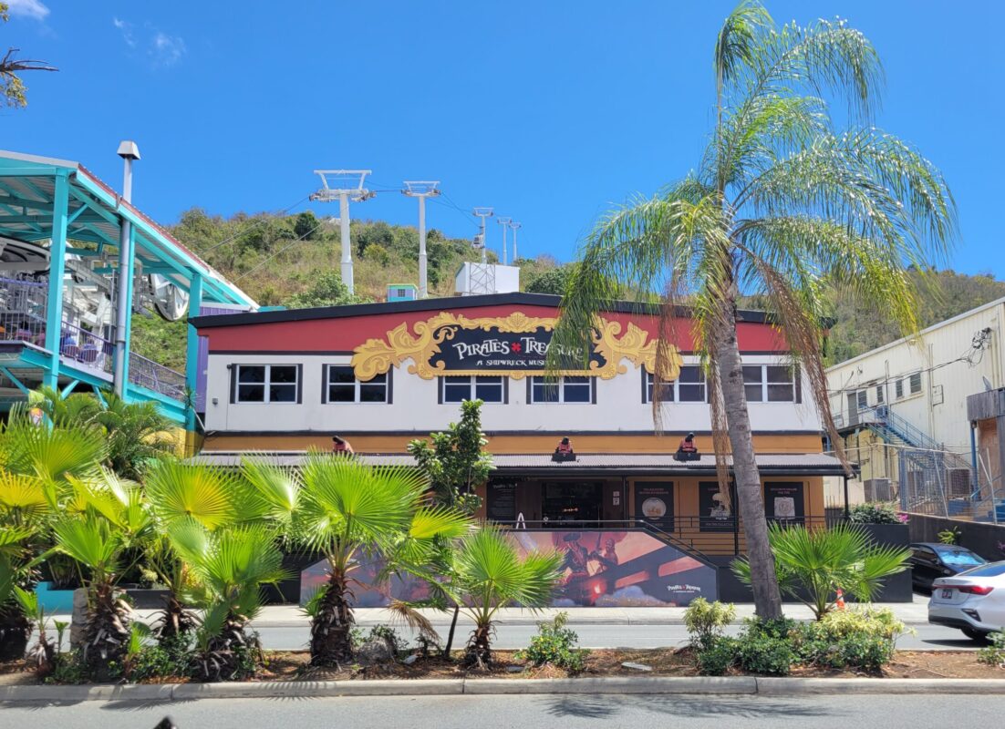 The Pirates Treasure Museum in St. Thomas, located near the Skyride to Paradise Point, showcasing a red and black façade with pirate-themed signage.