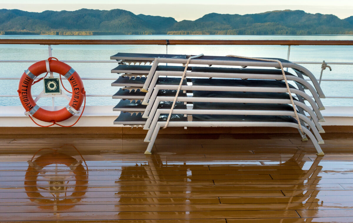 Are Cruise Ships Safer Than Hotels | Photo of a freshly washed cruise ship deck with lounge chairs neatly stacked, illustrating routine cleaning protocols for passenger safety.