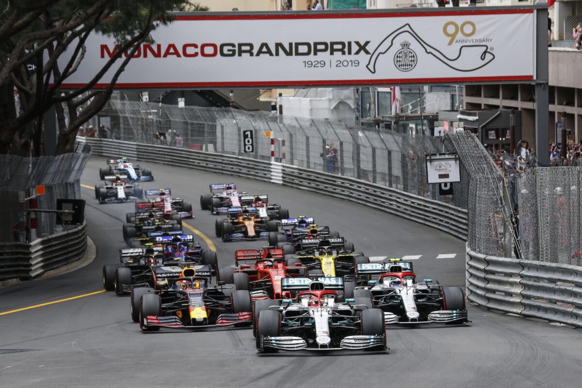 Formula 1 drivers battle for position on the twisting roads of Monte Carlo during the Monaco Grand Prix, a premier event among Mediterranean festivals.