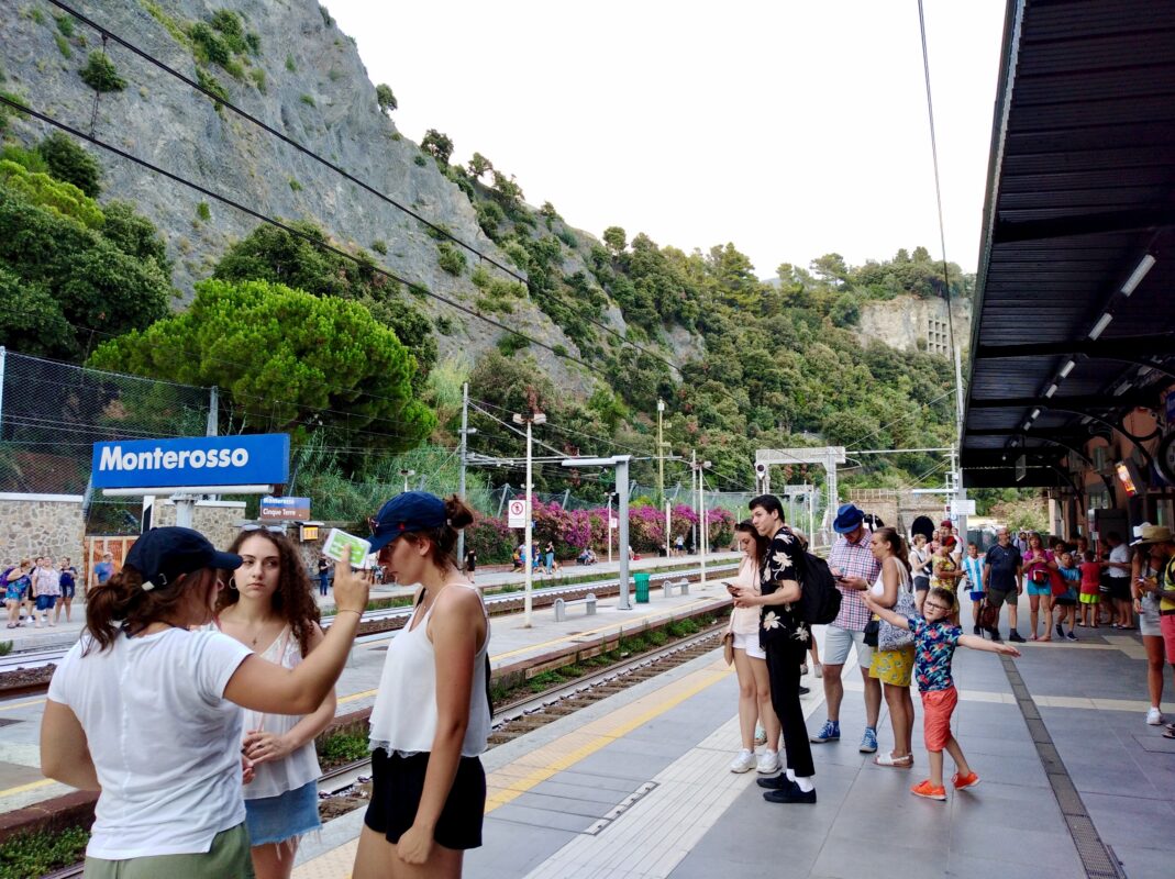 Monterosso al Mare railway station with visitors preparing to continue their Cinque Terre tour through the villages.