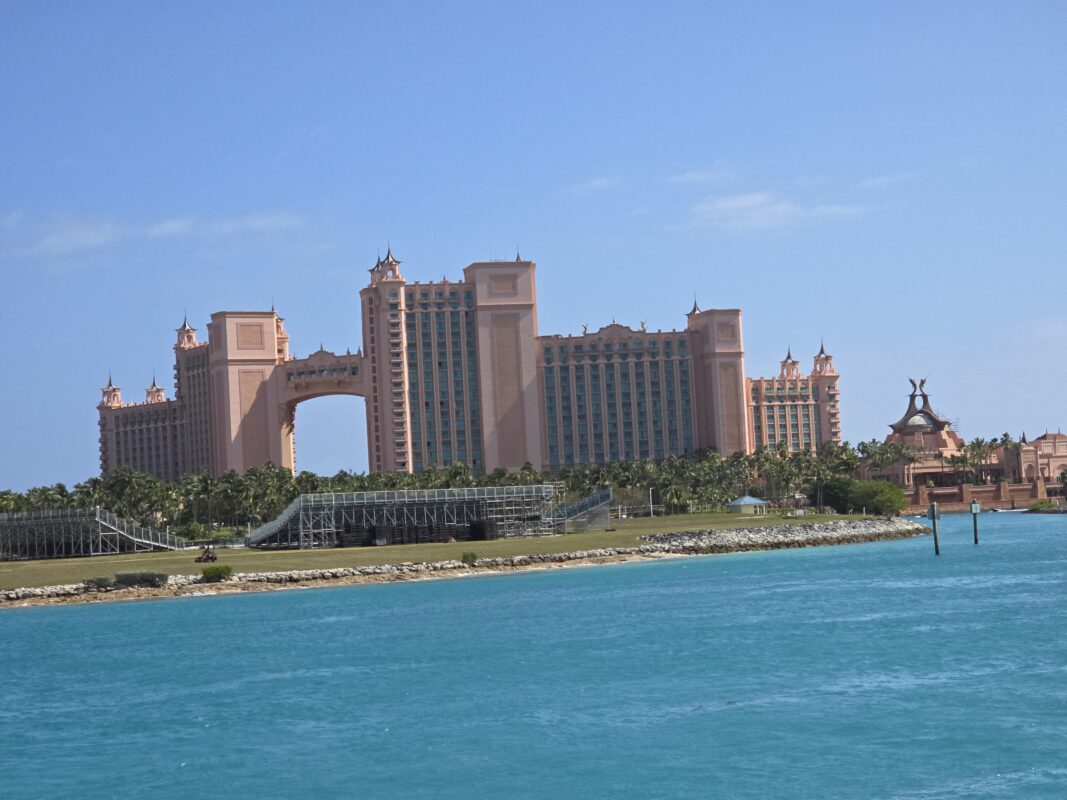 Waterfront view of Atlantis Resort in Nassau with distinctive twin towers and archway, a major attraction for cruise visitors to the Bahamas.