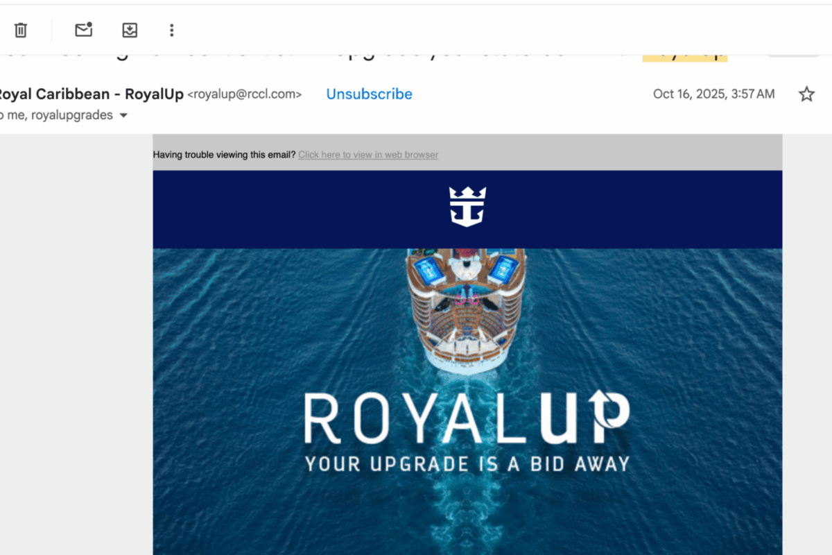 Screenshot of a Royal Caribbean Royal Up email showing the message ‘Your upgrade is a bid away’ above an aerial view of a cruise ship at sea.