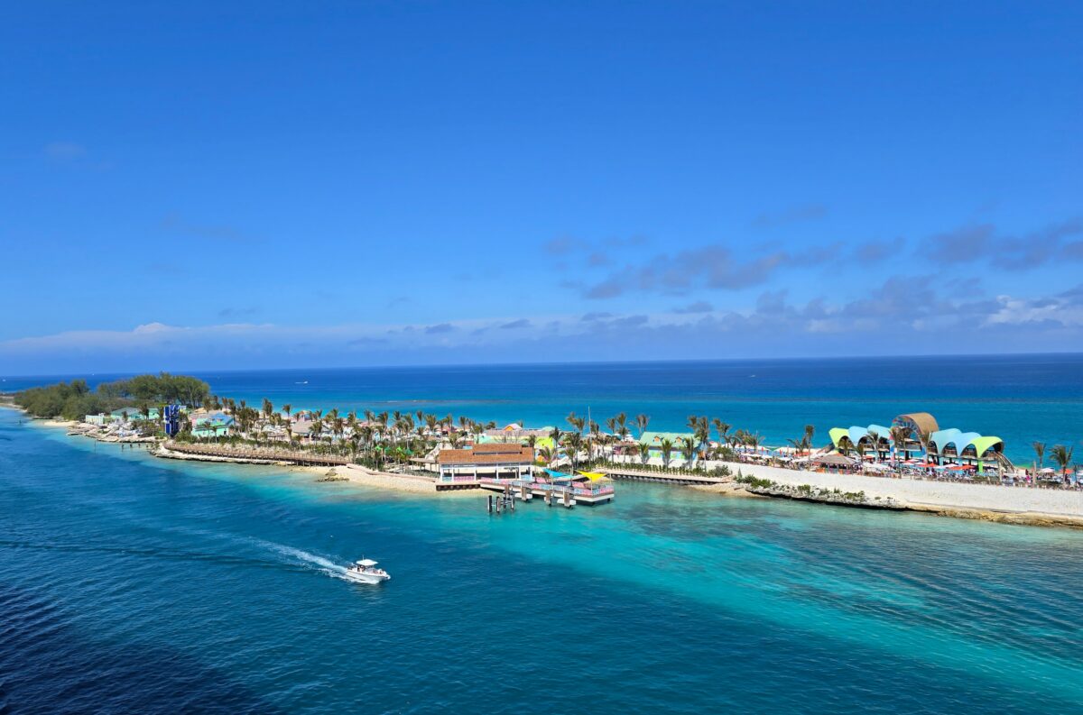 Elevated view of Royal Beach Club Paradise Island showing the shoreline, colorful structures, and vivid Bahamian water.