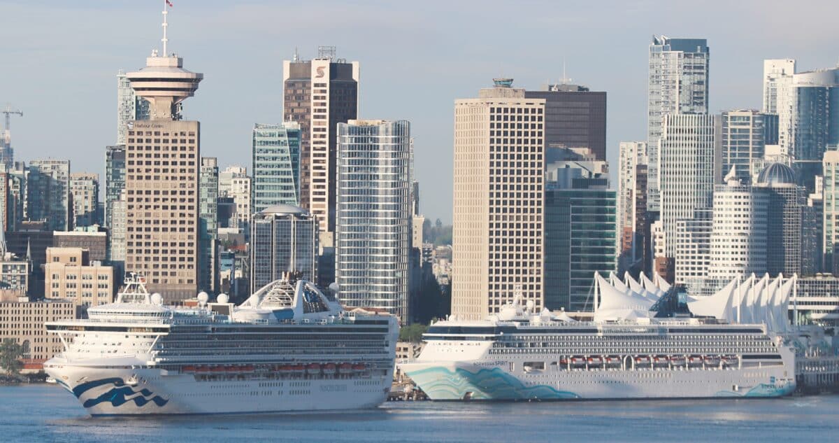 Grand Princess beside Norwegian Spirit with downtown Vancouver in the background.