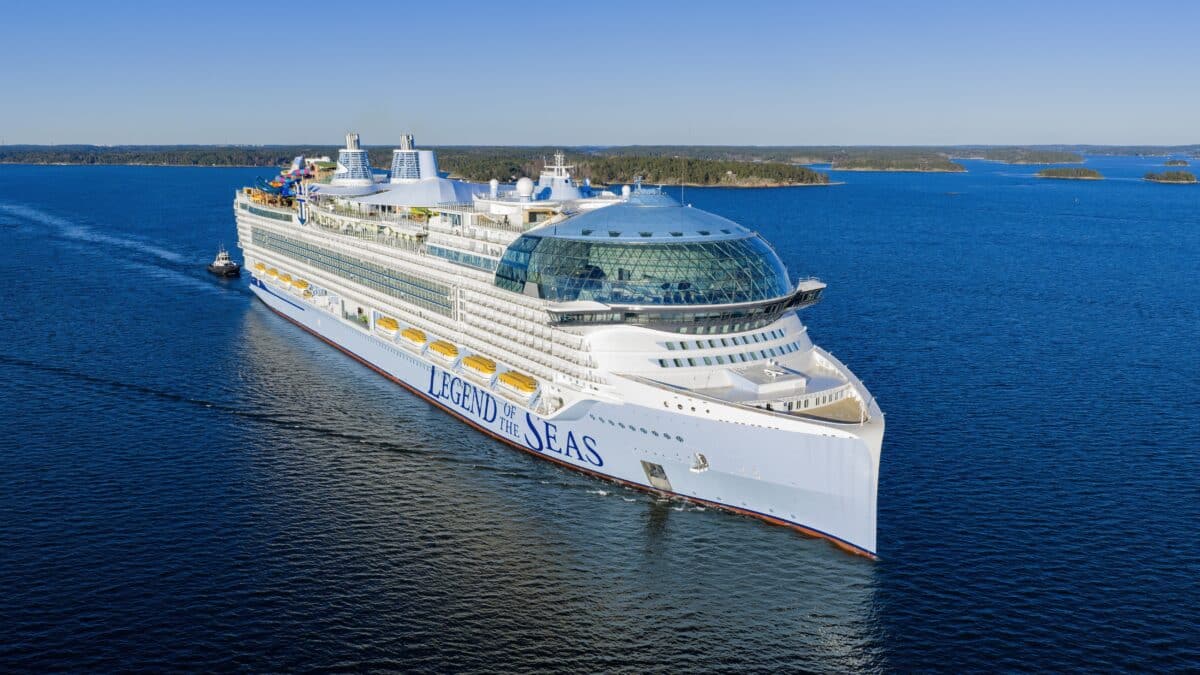 Legend of the Seas viewed from above, with its glass AquaDome and colorful water slides visible.